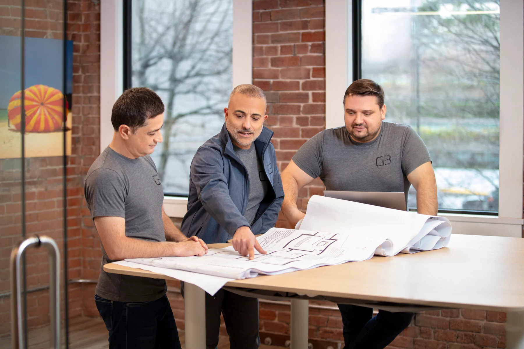 G3 Construction LTD. Team is around the table.